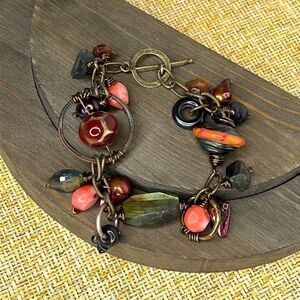 Artistic bracelet with wire wrapped stones.